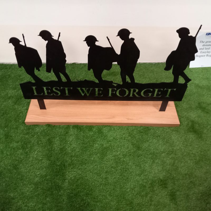 War Memorial soldiers plaque saying Lest We Forget