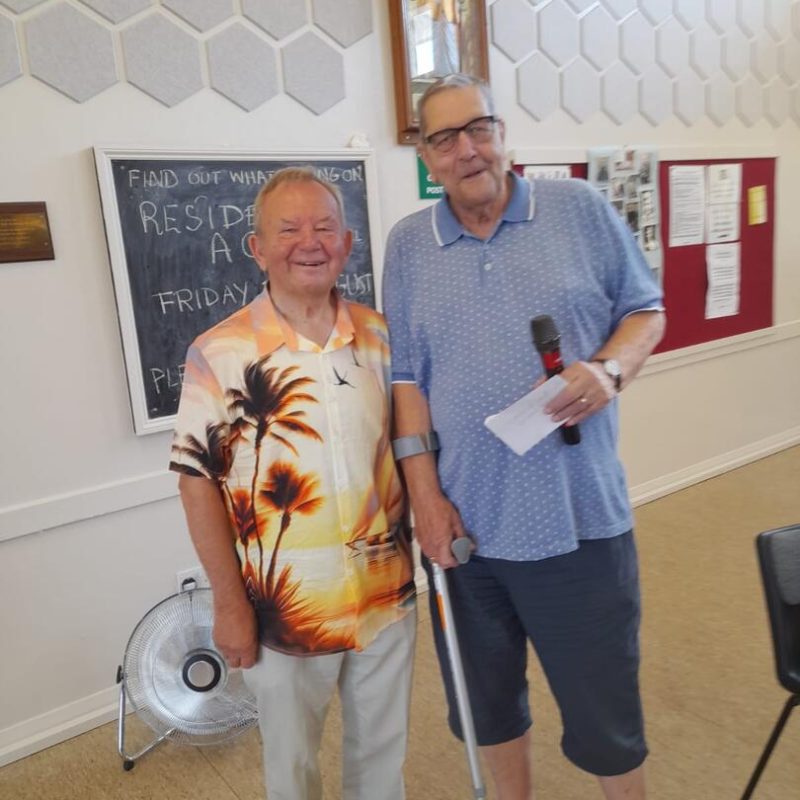 Chairman Brian Knight receives a cheque from Mike Nicholls on behalf of Westmeads Coffee Morning
