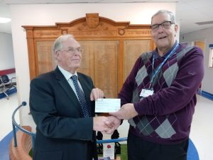 Stephen Hymes and Chairman Brian Knight in front of the War Memorial