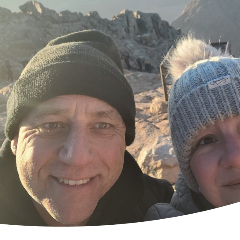 Kerry Matthews pictured on a hilltop, wearing a bobble hat